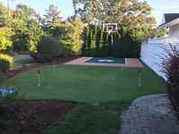 Backyard basketball court with putting green in Barnstable, MA.