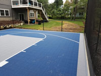 Residential basketball court in shades of blue in Lexington, MA.