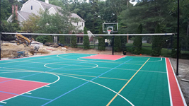 Backyard basketball court plus tennis and volleyball in Pembroke, MA. We could install backyard basketball for you in Provincetown, Grafton, Rockland, Hanson, Fairhaven or Burlington.