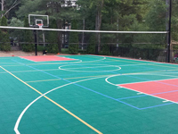 Backyard basketball court plus tennis and volleyball in Pembroke, MA. We could install backyard basketball for you in Randolph, Lakeville, Stoughton, East Bridgewater, Berkley or Foxborough.