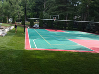 Backyard basketball surface, hoops, lights, and rebound fence in Pembroke, MA. We sport basketball and other courts that can be yours in Dennis, Orleans, Barnstable, Wakefield, Stoneham or Marblehead.