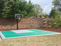Backyard basketball court in Bridgewater, MA. Whatever your sport, you could have a court surface and accessories of your own in Dighton, Westport, Swansea, Acushnet or Yarmouth.