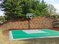 Backyard basketball court in Bridgewater, MA. Whatever your sport, you could have a court surface and accessories of your own in Norton, Westwood, Walpole, Cohasset or Needham.