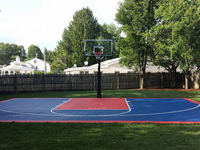 Backyard basketball court in Canton, MA. Whatever your sport, you could have a court surface and accessories of your own in West Roxbury, Allston, Chestnut Hill, Winchester or Concord.