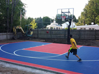 Backyard basketball court in Canton, MA. Whatever your sport, you could have a court surface and accessories of your own in Grafton, Truro, Wellfleet, Eastham or Manchester-by-the-Sea.