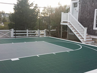 Backyard basketball court in Plymouth, MA. Whatever your sport, you could have a court surface and accessories of your own in Belmont, Holliston, Arlington, Wrentham or Saugus.