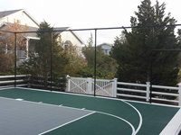 Backyard basketball court in Plymouth, MA. Whatever your sport, you could have a court surface and accessories of your own in Easton, Wellesley, Newton, Milton or Brookline.