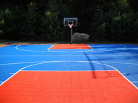 Full size blue and orange basketball court in Bellingham, MA.