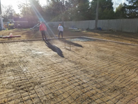 Prep work for construction of dark green basketball court in Duxbury, MA.