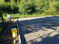 Packed sand, ready for us to pour cement for base of basketball court in Easton, MA.