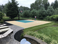 Easton, MA sand and green colored court after landscaping was completed by the owner.