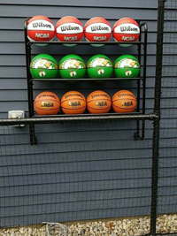 Backyard basketball court is the sort of thing you might find in Fairhaven, MA or a yard like yours. Featuring closeup of basketball rack personalization by customer.