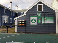 Backyard basketball court is the sort of thing you might find in Fairhaven, MA or a yard like yours. Includes customer embellishments to their court area, with basketball rack, Celtics banners, and Larry Bird shirt.
