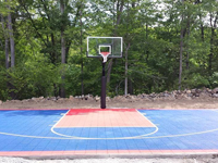 Basketball backyard court installation in North Attleboro, MA. If you have the space for a backyard basketball court in Boston, Brighton, Allston, West Roxbury or Hyde Park, Naturescape can make it happen.
