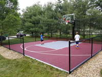 Red basketball court with titanium (silver) key in a side yard in Groton, MA.