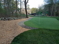 Backyard basketball court as part of a larger project including stump removal, landscaping, firepit and a putting green in Hanover, MA.