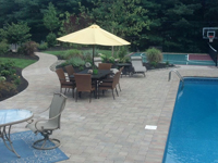 Backyard basketball court with tennis, landscaping and pool deck in Kingston, MA