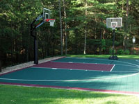 Backyard basketball court that doubles as tennis court in Kingston, MA