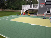 Basketball court in Needham, MA, shown after followup landscaping.