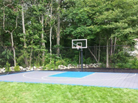 Backyard basketball court with lights for night play in Massachusetts. This could be in Concord, Medfield, Lincoln, Hyannis, Rehoboth, or a happy backyard in your neighborhood.