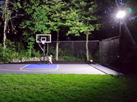 Backyard basketball court with lights for night play in Massachusetts. This could be in Boxborough, Belmont, Sharon, Holliston, Arlington, or a happy backyard in your neighborhood.