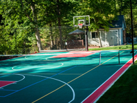 Backyard basketball court, landscaping, wall and patio in Stoneham, MA.