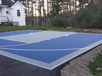 Backyard basketball court that doubles as tennis court in Kingston, MA