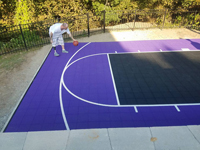 Backyard basketball court in Stoneham, MA. Whatever your sport, you could have a court surface and accessories of your own.