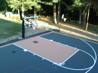 Backyard basketball court on a blacktop pavement surface in Walpole, MA.