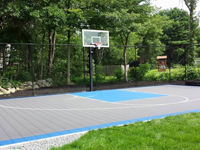 Backyard basketball court in West Bridgewater, MA. Whatever your sport, you could have a court surface and accessories of your own in Saugus, Lynn, Swampscott, Medway or Taunton.