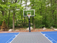 Close view down charcoal key at hoop goal system installed with basketball court in Ashland, MA.