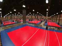 Wide view of completed indoor sport tile volleyball courts in convention center for New England Regional Volleyball Association (NERVA) Winterfest 2020 tournament in Hartford, CT.