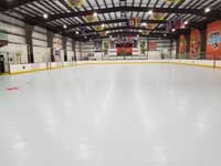 We traveled to Kapolei, Hawaii and inside to resurface two inline skate hockey rinks with Versacourt Speed Indoor tile. This is an after picture down much of the length of the first court.