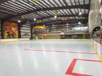 We traveled to Kapolei, Hawaii and inside to resurface two inline skate hockey rinks with Versacourt Speed Indoor tile. This is a portion of the completed first rink, including some of the lines.