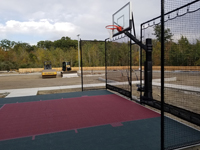 Small hotel basketball court in slate green and burgundy in Lincoln, RI.