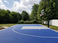 Side view of blue and silver basketball court in North Attleboro, MA.
