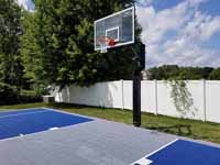 Blue and silver backyard basketball court in North Attleboro, MA.