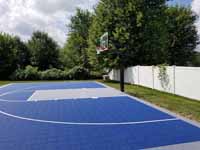 Blue and silver backyard basketball court in North Attleboro, MA.