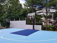 Happy backyard basketball court in shades of blue in Pocasset, MA.