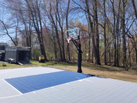 Ice and royal blue backyard basketball court in South Hadley, MA.