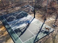 Large basketball court in Spencer, MA, with removable, adjustable add-on net for tennis and other games.