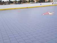 Photo from Scottsdale, Arizona installation of inline skating hockey rink for NHL Coyotes and the Boys & Girls Club, at Laguna Elementary. Removal of old surface, prep, installation of Versacourt IceCourt Outdoor Speed tile, and finished surface with custom logos.