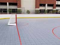 Side view of goal at one end of freshly built and surfaced outdoor inline hockey rink at Grand Canyon University in Phoenix, AZ.